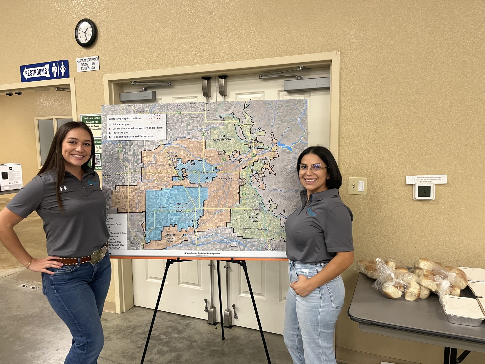 representatives from GKGSA stand with a map of the central valley